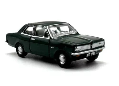 Vintage diecast metal coupe model car, dark green, front 3/4 view