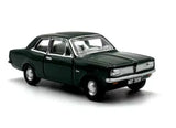 Vintage diecast metal coupe model car, dark green, front 3/4 view