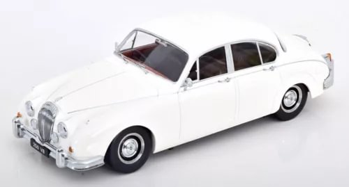 White classic diecast car model, front three-quarter view, detailed interior visible