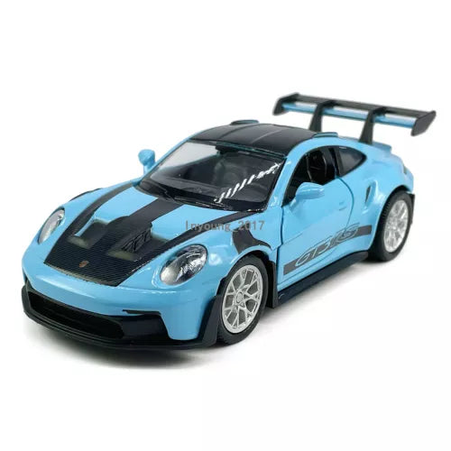 Die-cast model sports car, light blue with black hood and rear spoiler