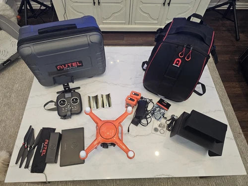 Drone accessories bundle with hard case, controller, and spare battery modules