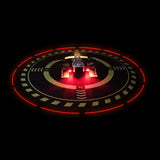 Round drone landing pad with red LED ring and green directional markings