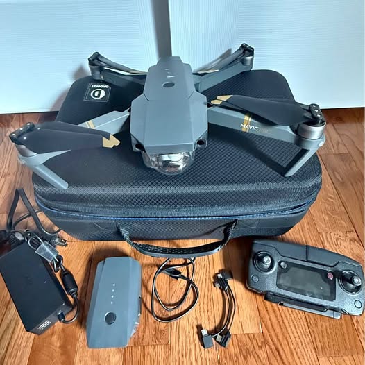 Foldable quadcopter drone with controller, battery, and accessories in zip bag