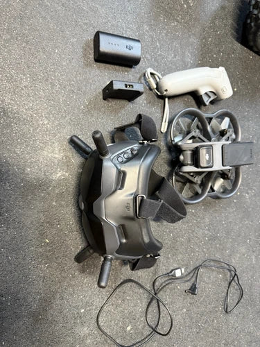 DJI Avata drone with gray body, controller, and cables accessories