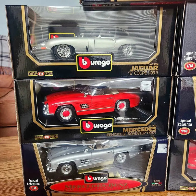 1:18 Burago diecast cars in boxes, red and silver models