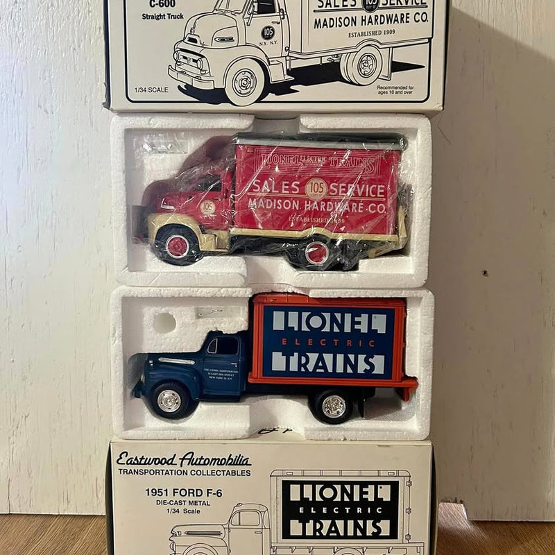 1/34 diecast trucks set in display box, red and blue service vehicles