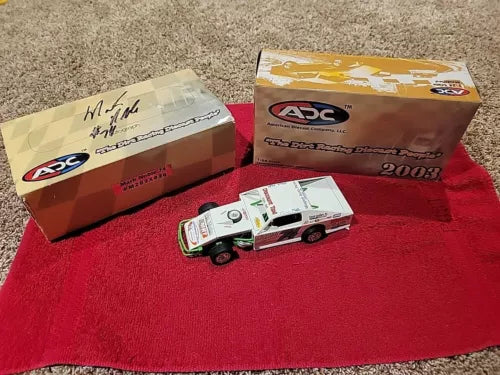Autographed 1:24 modified dirt racing diecast car with sponsor decals
