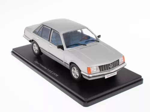 Die-cast model car in light gray, front three-quarter view