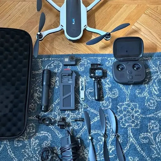 GoPro Karma drone kit with remote, camera, propellers, and accessories in open case