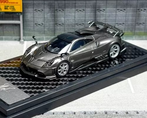 Gray metal diecast sports racing car model on black display base