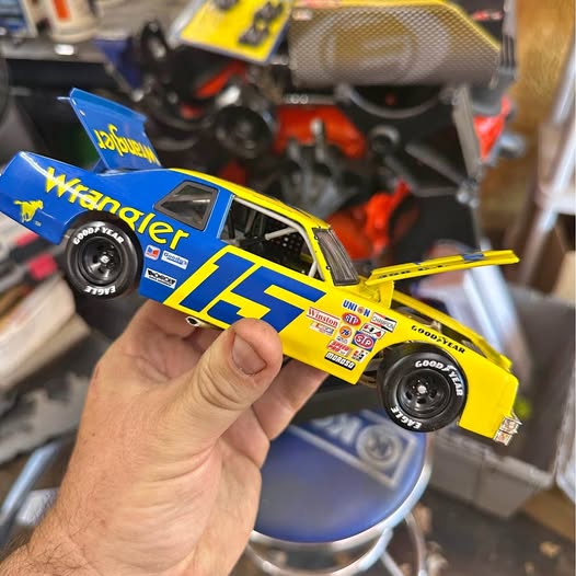 Yellow and blue die-cast race car with Wrangler graphics and number 17 on side