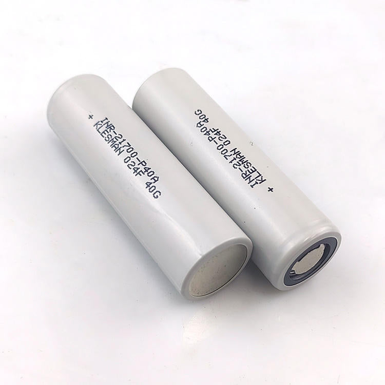 Lithium-ion battery cells, two cylindrical silver cells with printed markings