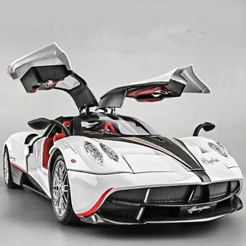 White and black diecast racing sports car model with open doors, front 3/4 view