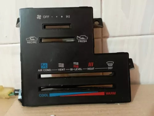 Black car climate control panel with fan, air vent, and temperature buttons