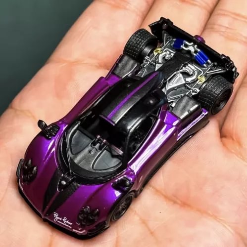 Purple diecast sports racing toy car model with detailed cockpit and tires
