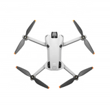 White quadcopter drone with four folding arms and four orange-tipped propellers