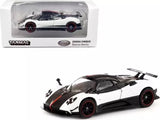 White and black diecast sports car model with red detailing and open cockpit style