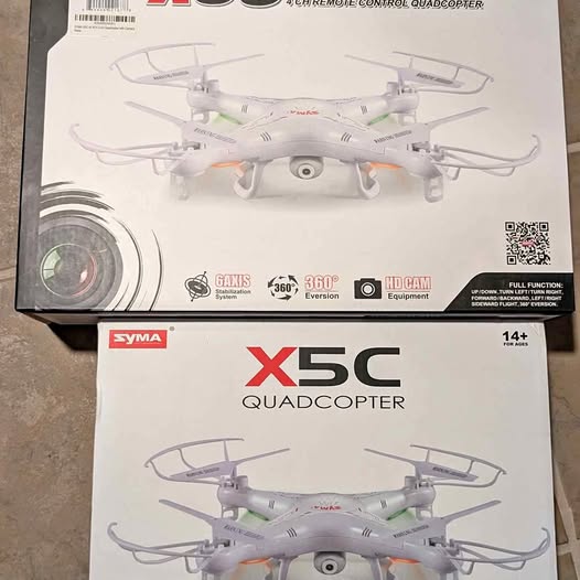 SYMA X5C quadcopter on retail box, white drone with gray details