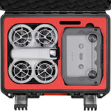 Hard carrying case with red foam insert holding drone and controller compartments