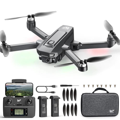 Black quadcopter drone with camera kit, controller, batteries and propellers