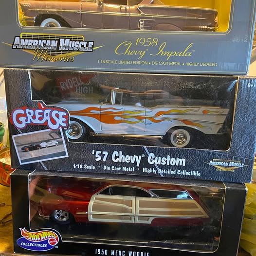 Boxed die-cast car collectibles: 1958 Chevy Impala and 1950 Merc Woodie models
