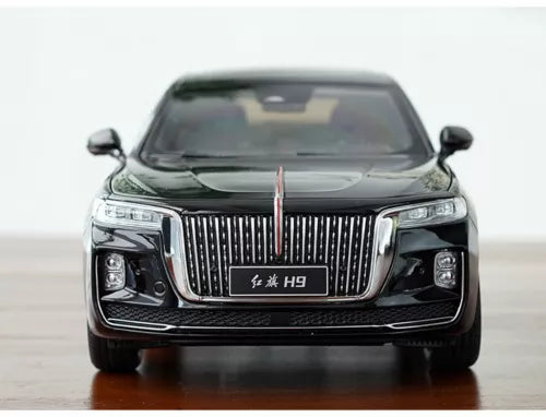 Black diecast car model toy, front view with chrome grille and headlights