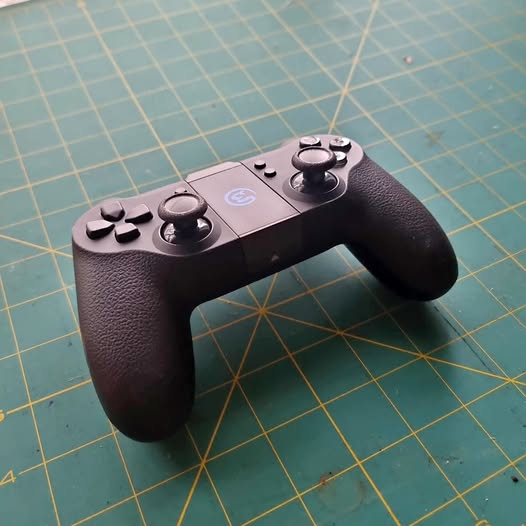 Drone controller with two thumbsticks and textured grips, black
