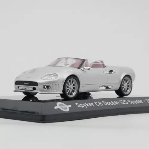 White convertible diecast sports car model with front 3/4 view on display base