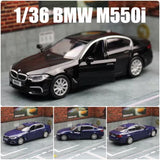 1:36 BMW M550i diecast toy car, black sedan with open doors and silver wheels