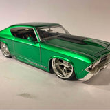 Jada 1/24 scale diecast green classic car with black hood and chrome wheels