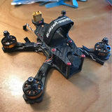 Carbon fiber quadcopter drone with four motor mounts and propeller guards