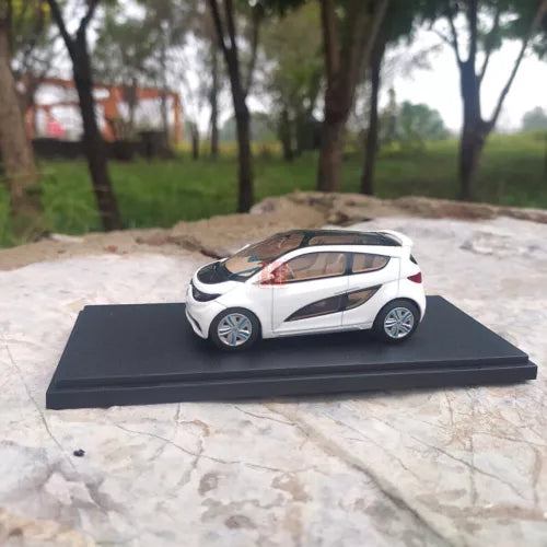 White concept car diecast model on black base, side view