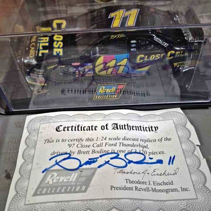 Certificate of Authenticity for a 1:24 scale diecast replica car with signature