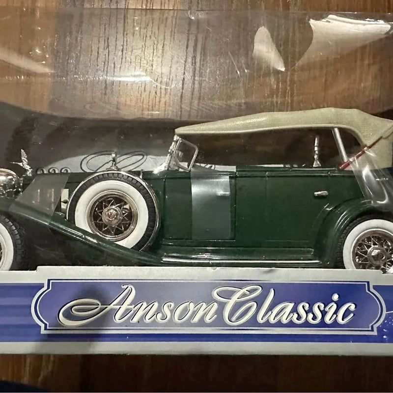 Green and white 1932 Cadillac sport phaeton diecast car with chrome wheels, Anson Classic badge