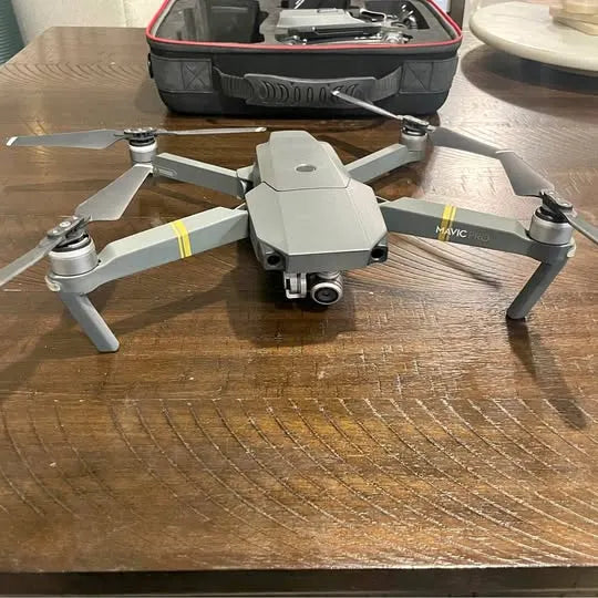 DJI Mavic Pro 4K drone with four propeller arms, gray body, front camera lens visible