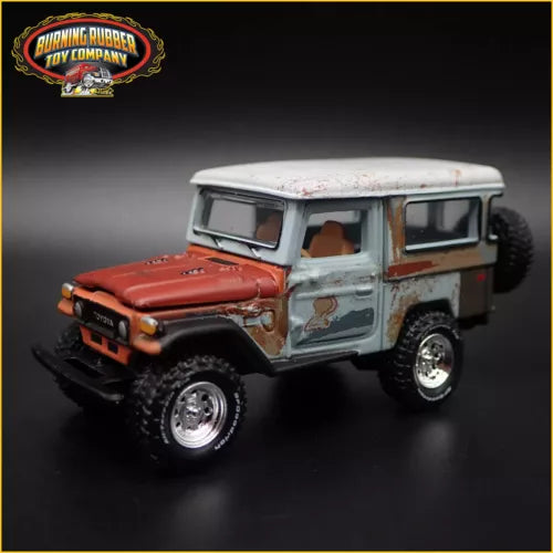 Diecast Toyota Land Cruiser FJ40 model car, red hood and light blue body, front view