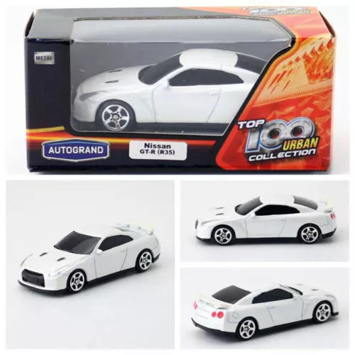 White Nissan GT-R R35 diecast model car toy in retail box, front and side angles.