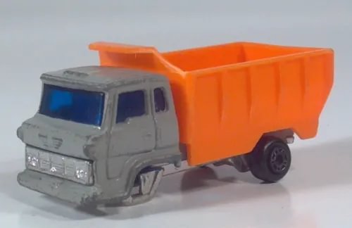 Vintage Hino dump tipper diecast truck with grey cab and orange tipping bed