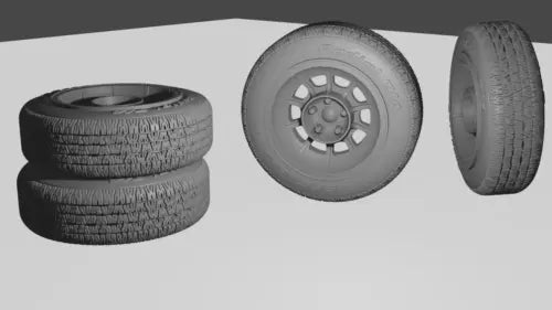 Unpainted diecast wheel and tire parts with textured black tires and gray rims