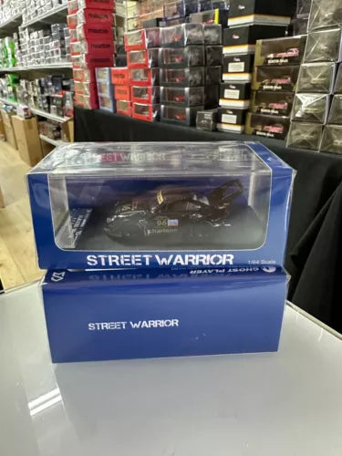 1/64 diecast toy car in blue display box with clear window and dark car inside