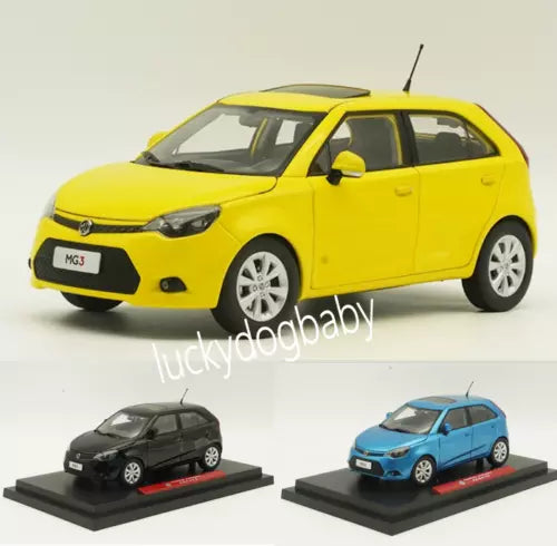 Yellow MG3 diecast car model on display base, front 3/4 view, antenna and headlights
