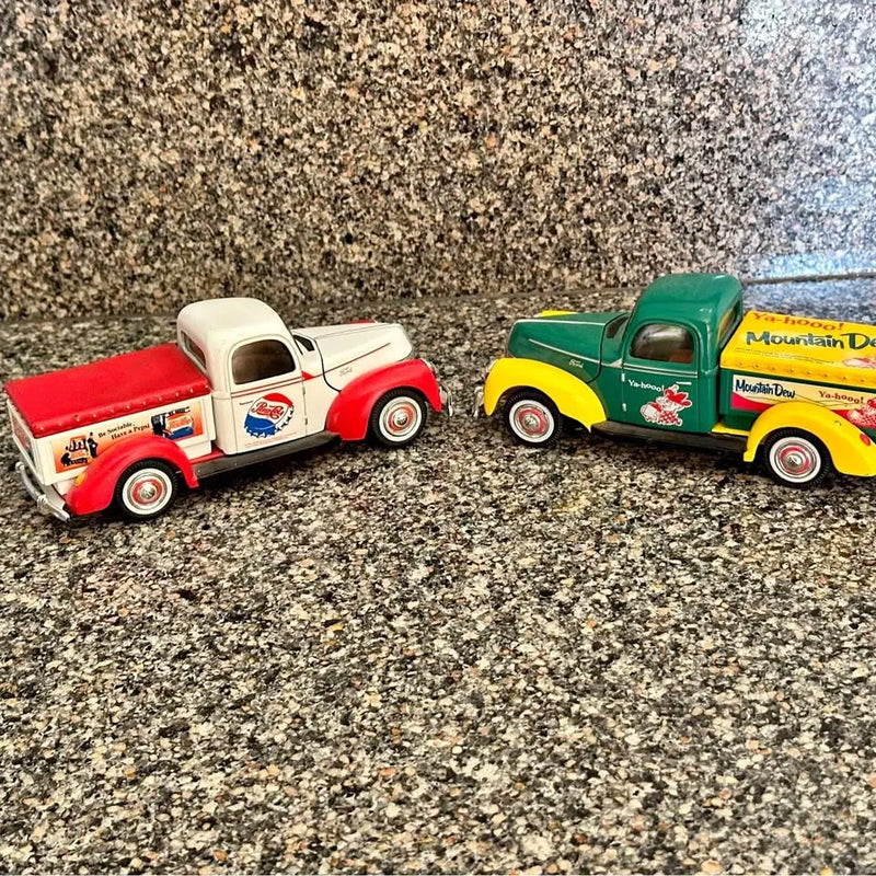 Diecast pickup trucks, red-and-white and green-and-yellow, St Michael MN