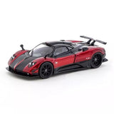 Red and black diecast sports car model with rear spoiler and open hood details