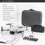 GPS aerial drone kit with controller, carrying case, and spare propellers