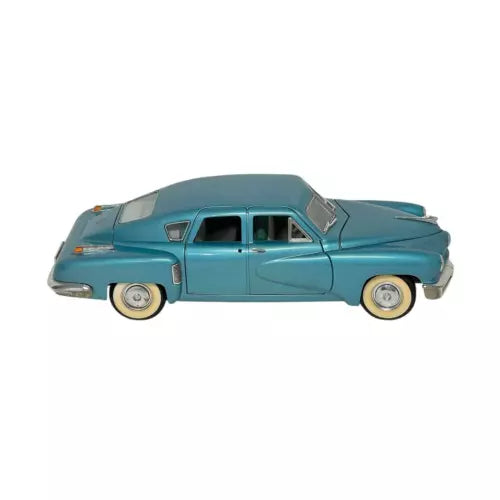 1:18 diecast vintage car model, teal blue with white-wall tires and chrome trim