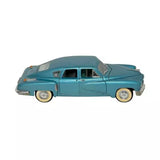 1:18 diecast vintage car model, teal blue with white-wall tires and chrome trim