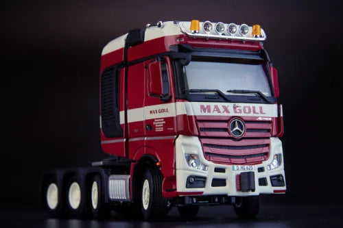 Red diecast tractor truck model with Mercedes emblem, chrome grille and front headlights