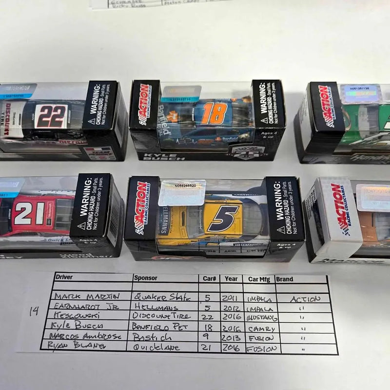 NASCAR diecast car models in boxed packaging, with visible car numbers and warning labels
