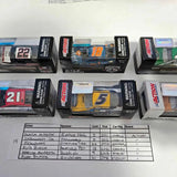 NASCAR diecast car models in boxed packaging, with visible car numbers and warning labels