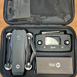 Grey drone and controller in black hard carrying case
